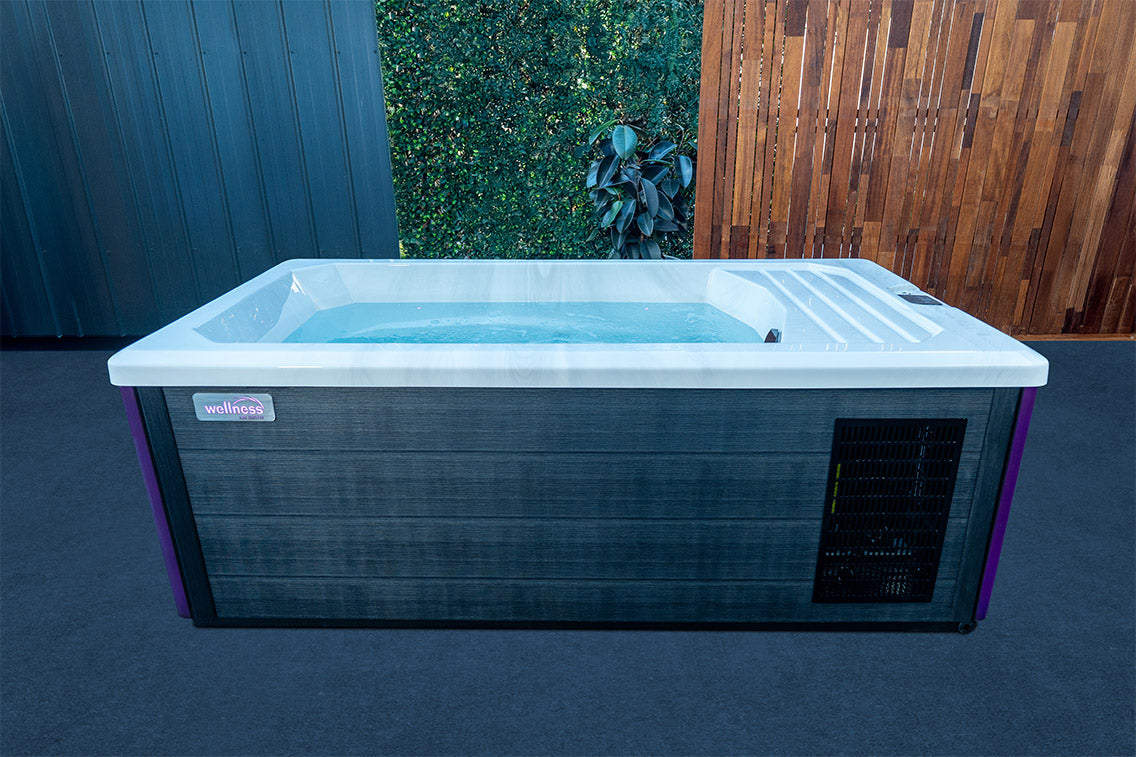 Wellness Ice Bath filled with water in a modern outdoor setting, featuring insulated cabinetry and built-in cooling system, perfect for backyard cold plunge, muscle recovery and wellness therapy in New Zealand.