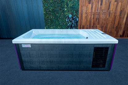 Wellness Ice Bath filled with water in a modern outdoor setting, featuring insulated cabinetry and built-in cooling system, perfect for backyard cold plunge, muscle recovery and wellness therapy in New Zealand.